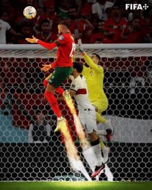 a soccer player with the number 10 on his jersey jumps in the air