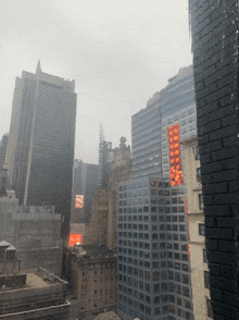 a view of a city skyline with a few buildings including one that says ' prudential ' on the side