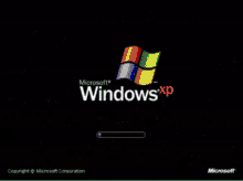 a microsoft windows xp loading screen with snow falling around it