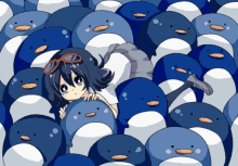 a girl is surrounded by a bunch of penguins