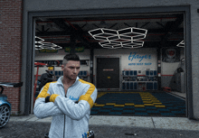 a man stands in front of a garage that says hayer auto soft shop