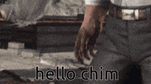 a man in a suit says hello chim in a video game