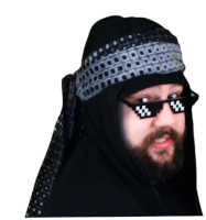 a man with a beard wearing a head scarf and sunglasses