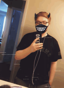 a person taking a selfie with a mask that says onee on it