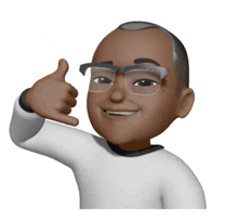 a man with glasses is giving a thumbs up