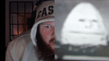 a man wearing a cas hat looks at a blurred image