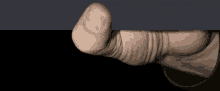 a close up of a person 's thumb pointing at something