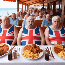 three men wearing british flag tank tops sit at a table with food