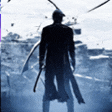 a silhouette of a man holding a sword in a foggy area .