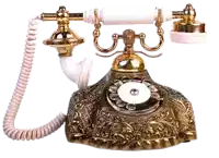 a gold and white telephone with a cord hanging off of it