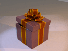 a purple gift box with a gold and brown striped bow