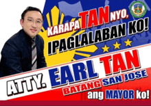 a man sitting in front of a banner that says atty earl tan