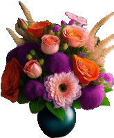 a vase filled with purple and pink flowers