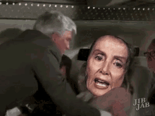 a man is holding a woman 's head in his arms while a woman screams .