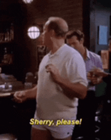 a man in underwear is standing in front of a bar and says sherry please .