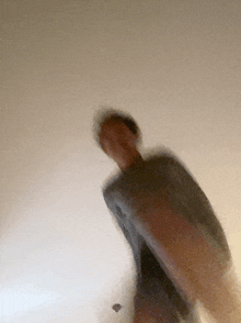 a blurry picture of a person standing on a staircase