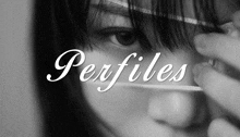 a black and white photo of a woman 's face with the words perfiles written above it