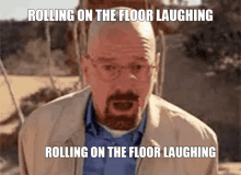 a man with a beard and glasses is rolling on the floor laughing and rolling on the floor laughing