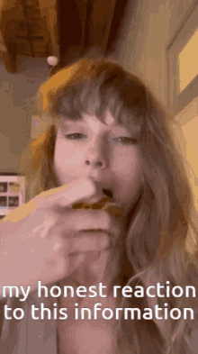 a woman eating a sandwich with the words " my honest reaction to this information "