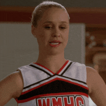 a cheerleader wearing a uniform that says wmuc on it