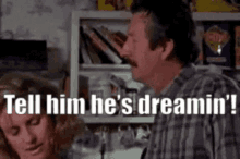 a man with a mustache is talking to a woman in a kitchen and says tell him he 's dreamin ' .