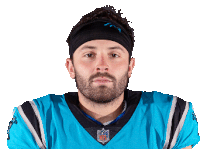 a man wearing a headband and an nfl jersey looks at the camera