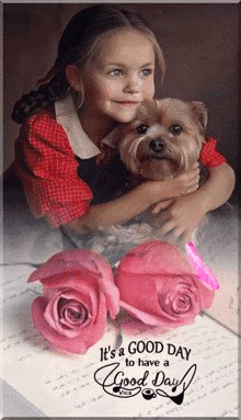 a picture of a little girl holding a dog with roses and the words it 's a good day to have a good day