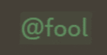 the word fool is written in green on a brown background