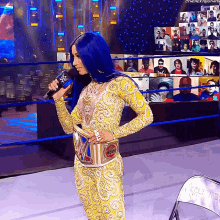 a woman with blue hair is speaking into a microphone while wearing a belt that says ' boss ' on it