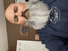 a man with a beard wearing a harley davidson sweatshirt