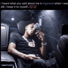 a man smoking a cigarette in a car with a caption that says i heard what you said about me