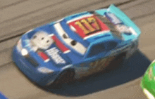 a blue race car with the number 17 on it is driving down a track .