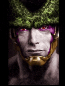 a close up of a man 's face with a green and purple helmet on