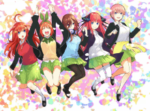 a group of anime girls are jumping in the air with their arms in the air