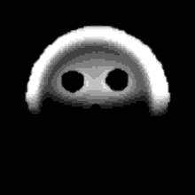 a pixel art of a skull with two eyes and a hood on a black background .