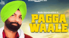 a man in a green turban stands in front of a sign that says " pagga waale "