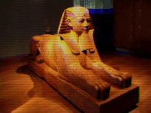 a statue of an egyptian sphinx with the letter t on its face