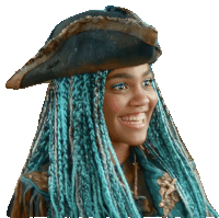 a woman with blue braids and a pirate hat smiles