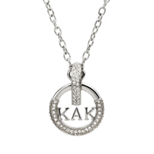 a silver necklace with the word kak in the center