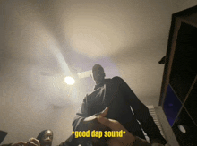 a man standing in a dark room with the words " good dap sound " written above him