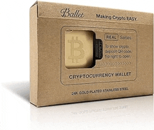 a wallet with a bitcoin symbol on it is in a cardboard box .