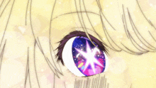 a close up of a girl 's eye with a star in the middle