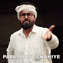 a man with a beard wearing glasses and a turban says papa bomb chaniye