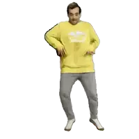 a man in a yellow sweatshirt with the number 15 on it