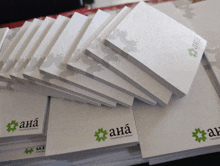 a stack of sticky notes with the ana logo on them