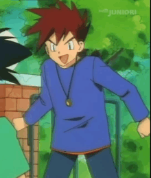 a boy with red hair is wearing a blue shirt with juniori written on the bottom