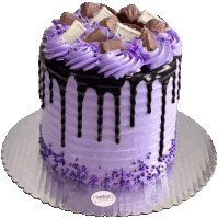 a cake with purple frosting and chocolate sprinkles from sugar trope