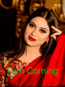 a woman in a red dress with the words " i am coming " on the bottom right