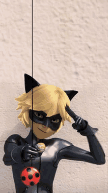 cat noir from miraculous ladybug is wearing a black catsuit and a black mask .