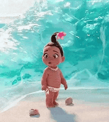 a baby girl from moana is standing on a beach near the ocean .